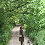 Lucy walking her blue whippet Betsy