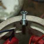 Extra bolt for ground contact of field coils.