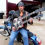 Robert Rodriguez with 'Yepes Signature' Gibson Custom "Shotgun Messenger" Double-Neck Guitar • Robert Rodriguez Collection; at Troublemaker Studios, Austin, Texas  USA