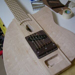 Wood bridge plate attached and string for check intonation.