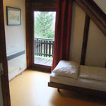 Kleines Schlafzimmer OG mit Zugang zum Balkon und Seeblick