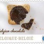 Il primo francobollo (di una serie di 5) emesso dal Belgio nel 2013,avente sia il profumo che il gusto del cioccolato