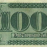Il retro della banconota da 1000$,con gli zeri che sembrano delle angurie