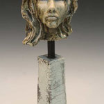 .Womans Head on Pillar……Bob Clyatt….Ceramic Raku……….1000