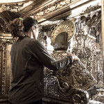 Pilgrim embraces the St. James statue