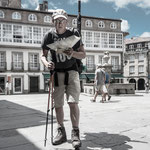 Pilgrim searching for directions to an albergue