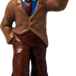 Figura del Reportero Tintín en América de la marca Yolanda en plástico blando de 7cm aproximadamente. Licenciada.