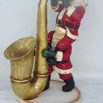 Figuras Santa Claus tocando saxofón