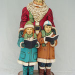 Figura de Santa Claus con niños cantando