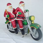 Figuras de Santa Claus en motocicleta