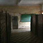 Tuol Sleng - blackboards between prison cells, Phnom Penh / Cambodia, Copyright © 2011