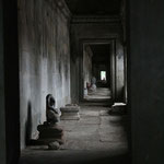 headless Buddha in a corridor, Angkor / Cambodia, Copyright © 2011