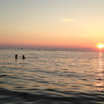 Sunset swim at Busola Beach