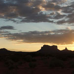 sun rising over Monument Valley