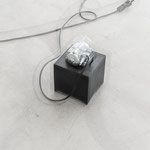 Umberto Cavenago, "Fremito creativo (occhi bianchi)", 2004, gomma nera, motore elettrico e luci led, 26×15×15 cm, ph. Ulrich Egger