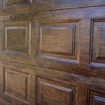 Even regular panel garage doors can look great with a faux painted wood treatment!