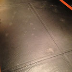 Damaged leather conference table