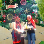 in front of the big christmas tree at the Martin place