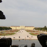 Following a Path, You Can See the Statues Up Close and the Palace in the Distance.