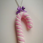 Pink & White Christmas Candy Cane necklace with a Purple Bow