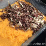 spread the meat over half of the sweet potatoes