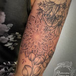 dotwork mandala flower tattoo