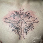 moth floral fineline chest tattoo