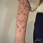 fineline ornamental lowerarm tattoo feminine