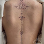 spine lotus ornamental fineline tattoo