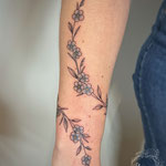 wrap around tattoo lowerarm fineline forget me not flowers floral