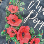 klaprozen op spijkerjasje voor bruid, waar? aim your wedding