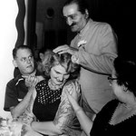 Meher Baba with Virginia & Harold Rudd in Longchamps Restaurant, Manhattan House, New York - 22 July 1956
