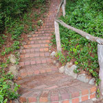 Summer 2025 : Brick stairway to the Original kitchen. Photo by Anthony Zois.