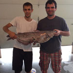 Ryan Christiansen and Jake McKenzie with a big old cat!