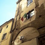 The Italian flag on a building.