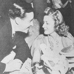 chatting with John Boles at a film party in the Coconut Grove 