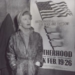 on the set of 'Never A Dull Moment' in front of a poster for "The Brotherhood Week"