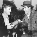 taking care of Patrick Knowles on the set of 'Lady In A Jam'