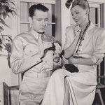 on the set - showing Alexander Knox how to knit