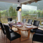 Dining table in front of the panoramic windows