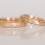 Eheringe 14 kt Rotgold kreisdiamantiert