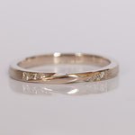 Ehering Möbiusband 14 kt Weissgold mit Diamanten