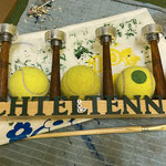 Some used tennis balls and a plastic fir for decoration.