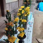 Flowers are waiting to be placed in the Hondo for Bishamon