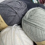 She wants something in grey, please. Not sure that is the right colour to lighten up one's mood, but alright.