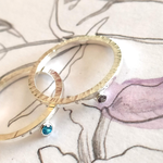 Zilver met zirkonia (links) of alexandriet