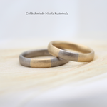 "Yumi" - Eheringe bicolor Weissgold/Gelbgold 750, Damenring 1280.- / Herrenring 1595.-