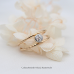 doppelreihiger Ring Gelbgold 750 mit Brillant 0.17ct, 1263.- 