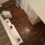 gerrards cross - client was selling property and needed to update on a budget. we discovered beautiful parquet flooring underneath a worn salmon pink hallway carpet