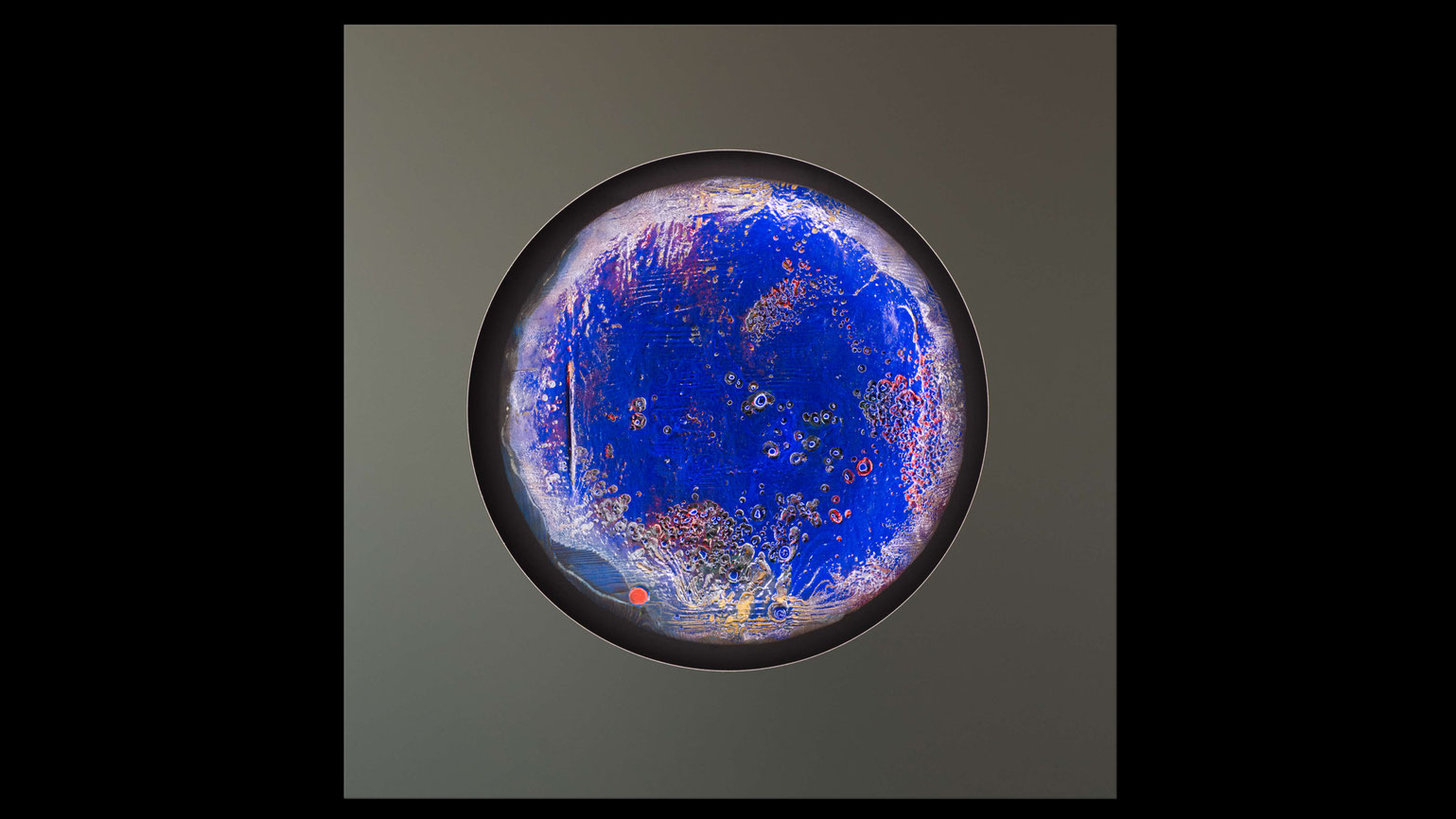 Light Object “Seasolight” (2020) – round artwork with intense blue tones, fiery details and subtle red accents, unique contemporary Burningpictures piece for galleries and curated interiors.